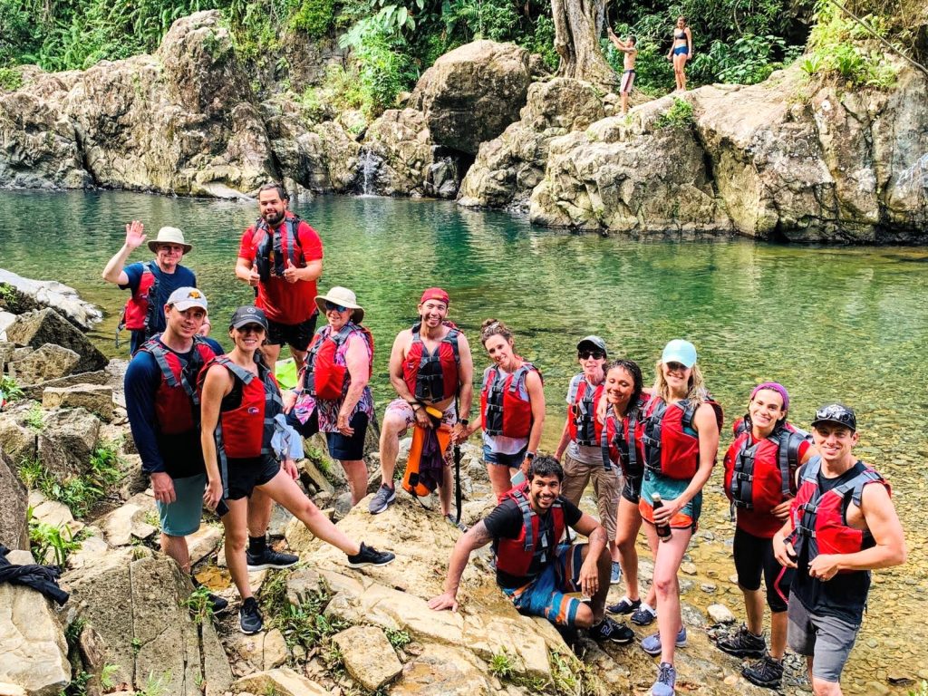 group posing by lagoon