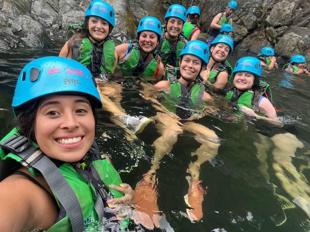 a group of happy people on a rainforest